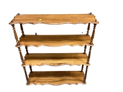 Lot 1305 - Edwardian walnut hanging wall shelves, 64cm wide, 18.5cm deep, 73.5cm high