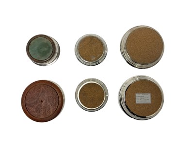 Lot 265 - Set of four graduated silver coasters and two further with turned wo...