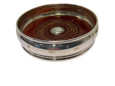 Lot 265 - Set of four graduated silver coasters and two further with turned wo...
