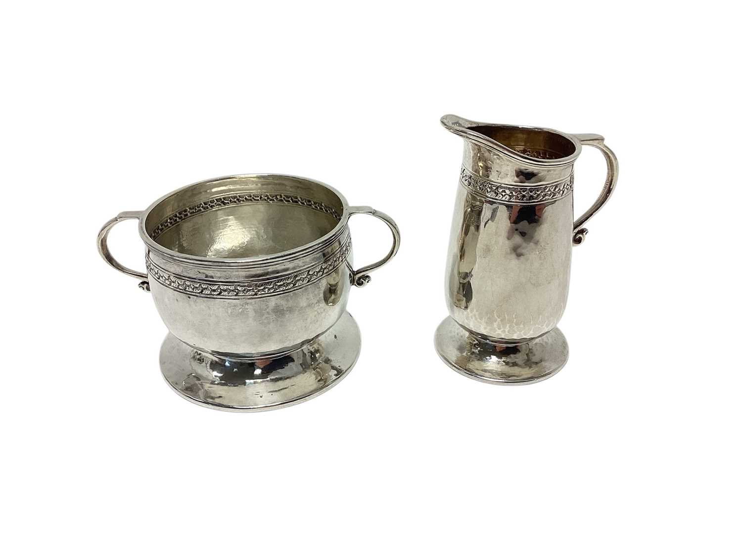 Lot 272 - Liberty and Co silver cream jug and ensuite sugar bowl...