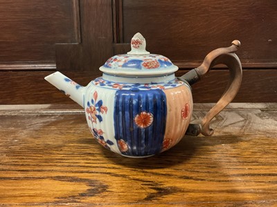 Lot 115 - Late 17th/18th century Chinese fluted Imari porcelain teapot with replacement walnut handle, 18.5cm from spout to handle