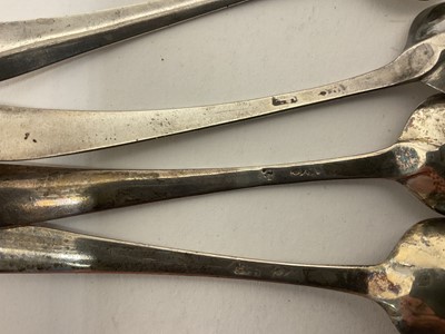 Lot 277 - Set of four Georgian oval salts on paw feet, with blue glass liners and spoons