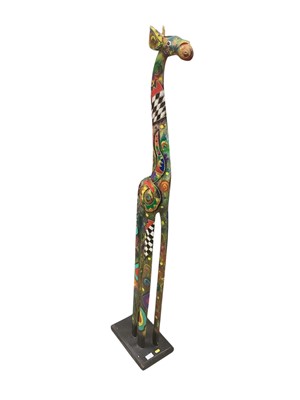 Lot 8 - Very decorative carved and painted wooden giraffe, approximately 150cm high