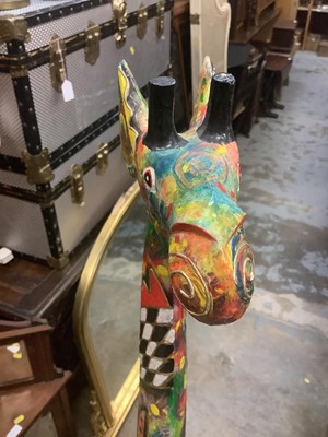Lot 8 - Very decorative carved and painted wooden giraffe, approximately 150cm high