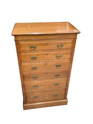 Lot 1356 - Late Victorian Maple & Co. Golden oak narrow chest of six drawers with gilt brass handles 68cm wide, 40cm deep, 117cm high