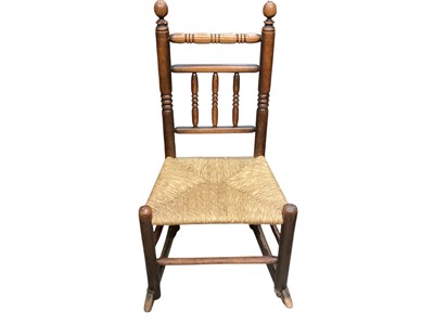 Lot 1330 - Antique spindle back rocking chair with rush seat