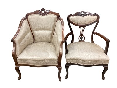 Lot 1340 - Two Edwardian carved mahogany framed open armchairs with floral upholstery