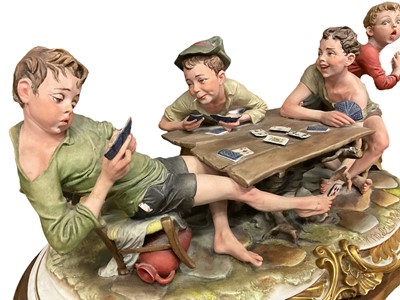 Lot 231 - Large Capodimomnte porcelain figure group 'The cheaters' together with a collection of capodimonte and similar figures