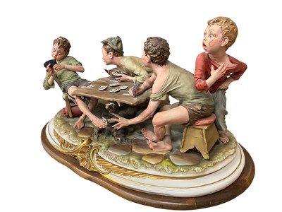 Lot 231 - Large Capodimomnte porcelain figure group 'The cheaters' together with a collection of capodimonte and similar figures