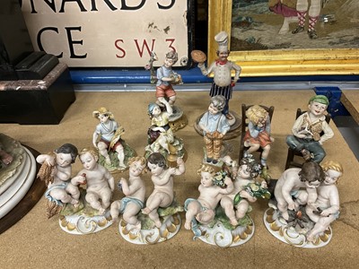 Lot 231 - Large Capodimomnte porcelain figure group 'The cheaters' together with a collection of capodimonte and similar figures