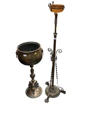 Lot 1344 - Late 19th century Dutch brass jardinere with lions head ring handles raised on circular base 89cm high and brass standard lamp (2)