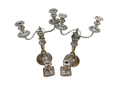 Lot 129 - Pair of silver plated candelabra and a pair of silver plated candlesticks