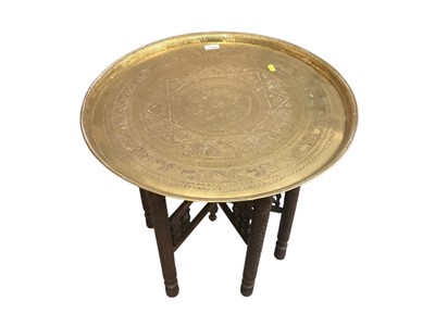 Lot 1350 - Indian Benares brass circular tray on folding wooden stand