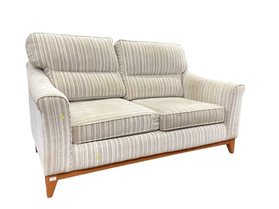 Lot 1371 - Contemporary two seater sofa with striped upholstery