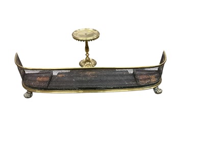 Lot 1385 - Victorian brass fender, together with a brass trivet (2)