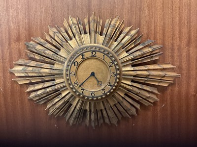 Lot 785 - Good quality Art Deco carved wood sunburst clock.