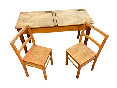 Lot 1407 - Vintage child's school desk and two chairs, the twin desk with two brass inkwells and two hinged tops, together with a matching pair of child's chairs