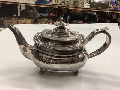 Lot 1087 - Georgian silver teapot with engraved decoration and shell thumb piece, raised on ball feet