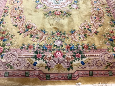 Lot 1408 - Large Chinese wool pile rug with floral decoration on yellow and pink ground, 372cm x 278cm