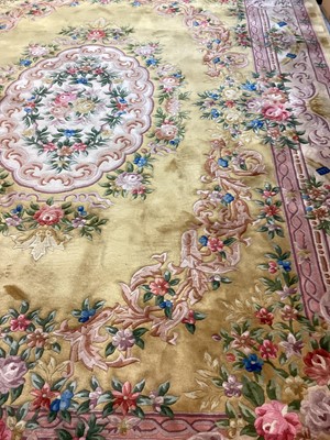 Lot 1408 - Large Chinese wool pile rug with floral decoration on yellow and pink ground, 372cm x 278cm
