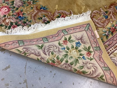 Lot 1408 - Large Chinese wool pile rug with floral decoration on yellow and pink ground, 372cm x 278cm