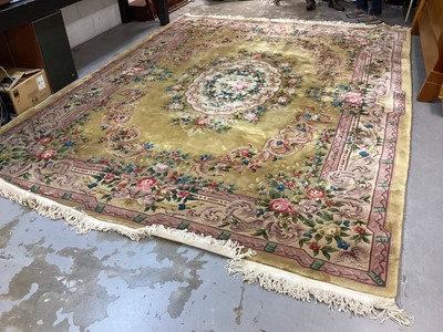 Lot 1408 - Large Chinese wool pile rug with floral decoration on yellow and pink ground, 372cm x 278cm