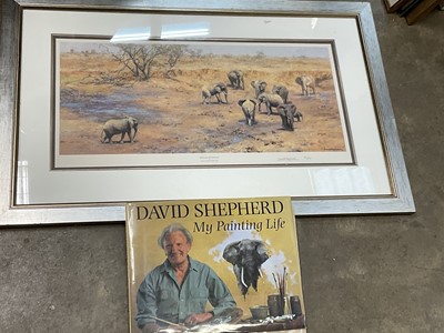 Lot 588 - David Shepherd signed limited edition colour print 'African Waterhole' signed and numbered 157/650, 12" x 27" in glazed gilt frame, together with a book. (2)