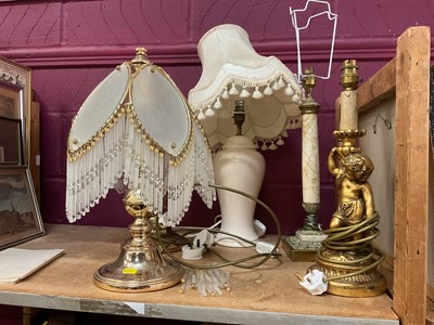 Lot 735 - Pair of brass lamps, a ceramic lamp and two others (5).