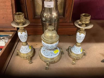 Lot 756 - 19th century French porcelain and brass desk set comprising inkwell and pair of candlesticks (3).