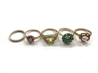 Lot 1118 - Four 9ct gold gem set dress rings and platinum wedding ring (5)