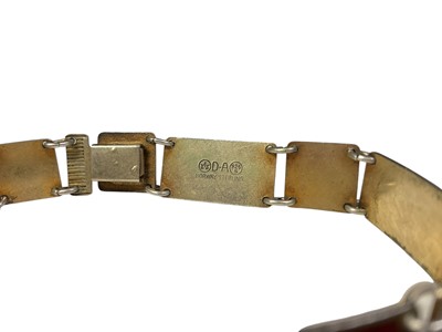 Lot 9 - David Andersen Norwegian silver, red and black enamel panel bracelet with flower head decoration