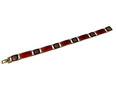 Lot 9 - David Andersen Norwegian silver, red and black enamel panel bracelet with flower head decoration