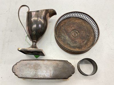 Lot 1131 - Georgian silver helmet shaped cream jug, silver wine coaster, silver mounted brush and a silver napkin ring