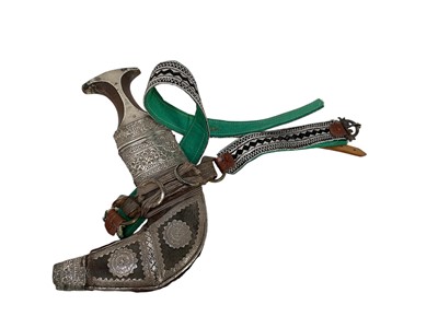 Lot 854 - Old Arab Jambiya dagger with ornate white mounted scabbard and belt.