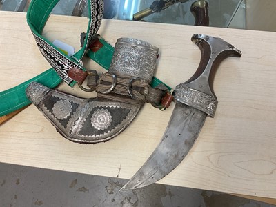 Lot 854 - Old Arab Jambiya dagger with ornate white mounted scabbard and belt.