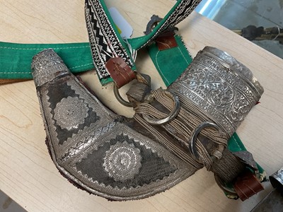 Lot 854 - Old Arab Jambiya dagger with ornate white mounted scabbard and belt.