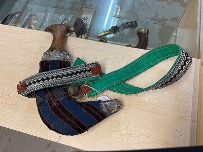 Lot 854 - Old Arab Jambiya dagger with ornate white mounted scabbard and belt.