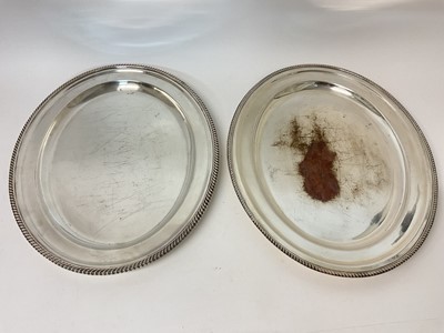 Lot 349 - Edwardian Harrods silver plated oval meat plate with gadrooned edge and one other similar (2)