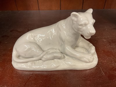 Lot 117 - Continental white glazed porcelain model of a lioness