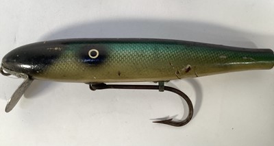 Lot 1198 - Two unusual very large carved wood and brightly painted fishing lures, 26cm and 21cm long
