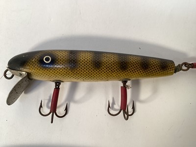 Lot 1198 - Two unusual very large carved wood and brightly painted fishing lures, 26cm and 21cm long
