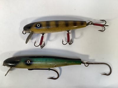 Lot 1198 - Two unusual very large carved wood and brightly painted fishing lures, 26cm and 21cm long