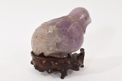 Lot 866 - Antique Chinese carved amethyst figure of a bird, on hardwood stand