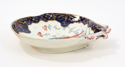 Lot 41 - A Worcester porcelain shell moulded dessert dish, circa 1770, decorated in enamels with the Sir Joshua Reynolds pattern, with gilt-patterned and wet blue border, 19cm wide