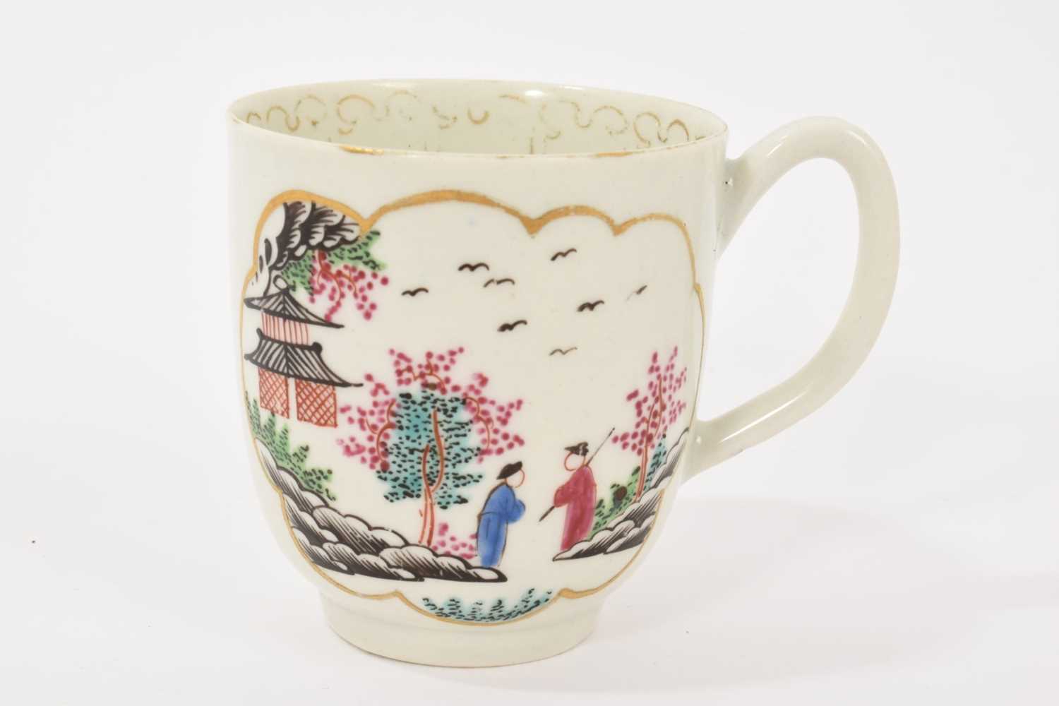 Lot 18 - A Worcester 'Stag Hunt' pattern coffee cup, circa 1765-70, with grooved handle, painted in bright enamels inside gilt-edged panels, the interior with a gilded arrowhead border, 6.25cm high