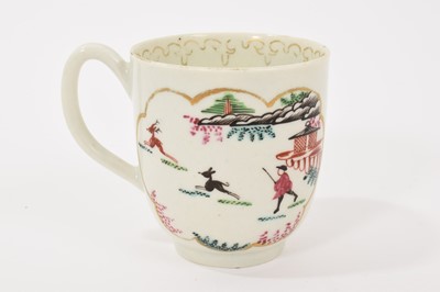 Lot 18 - A Worcester 'Stag Hunt' pattern coffee cup, circa 1765-70, with grooved handle, painted in bright enamels inside gilt-edged panels, the interior with a gilded arrowhead border, 6.25cm high