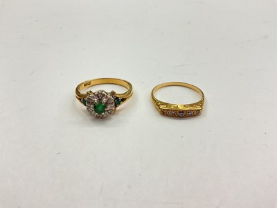 Lot 1043 - 18ct gold emerald and diamond cluster ring and a yellow metal diamond five stone ring (2)