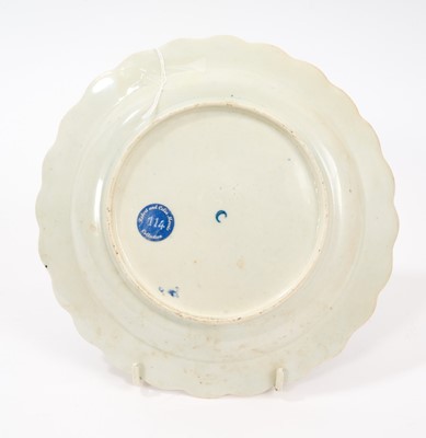 Lot 43 - A Worcester lobed circular plate, circa 1770, painted in the style of Jefferyes Hamett O'Neale (probably by an apprentice) with a lion standing by a tree, on a 'wet blue' ground within a formal...