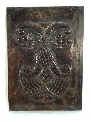 Lot 126 - A carved wood panel, possibly of Melanesian origin, 30cm x 22cm