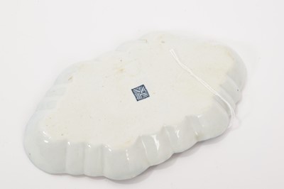 Lot 37 - A Worcester lobed hexagonal form spoon tray, circa 1768, painted with panels of flower sprays within gilt scrolled borders, reserved on a blue scale ground, square mark, 15cm wide